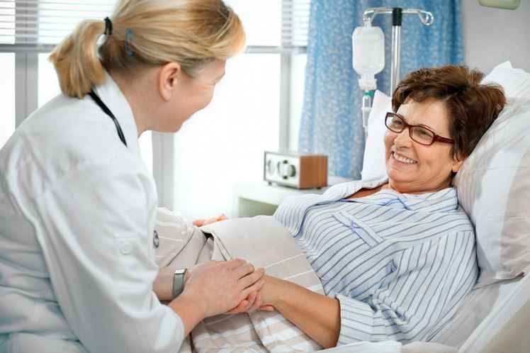 Female doctor holding a patient hand at the hospital bedside | Get a Rehydration Drip in Turkey | Online Doctor | E-rx.online