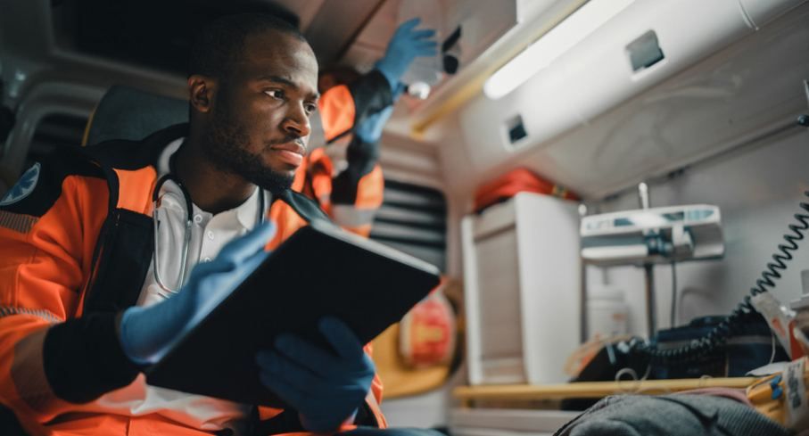 Paramedic using a tablet inside an ambulance for emergency care | Need Urgent Care in Bozburun? An On-Call Doctor Is a | Online Doctor | E-rx.online