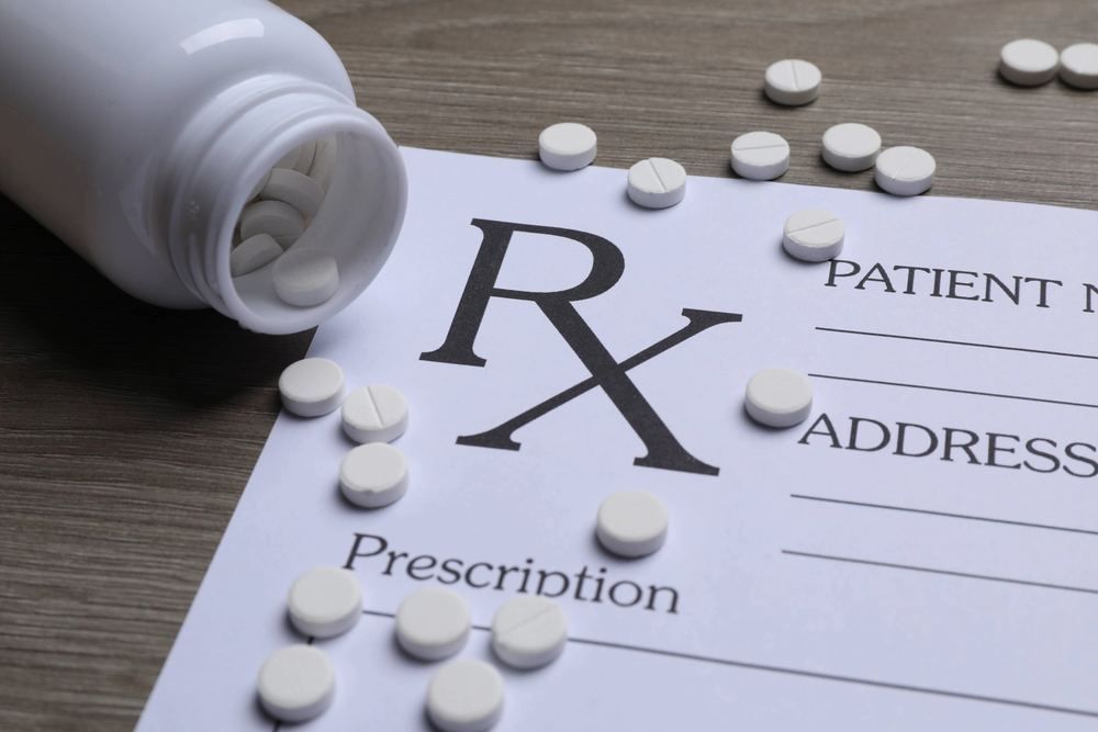 Prescription form with tablets spilling from a bottle | Have Blood and Swab Samples Taken at Your Home or Hotel in | Online Doctor | E-rx.online